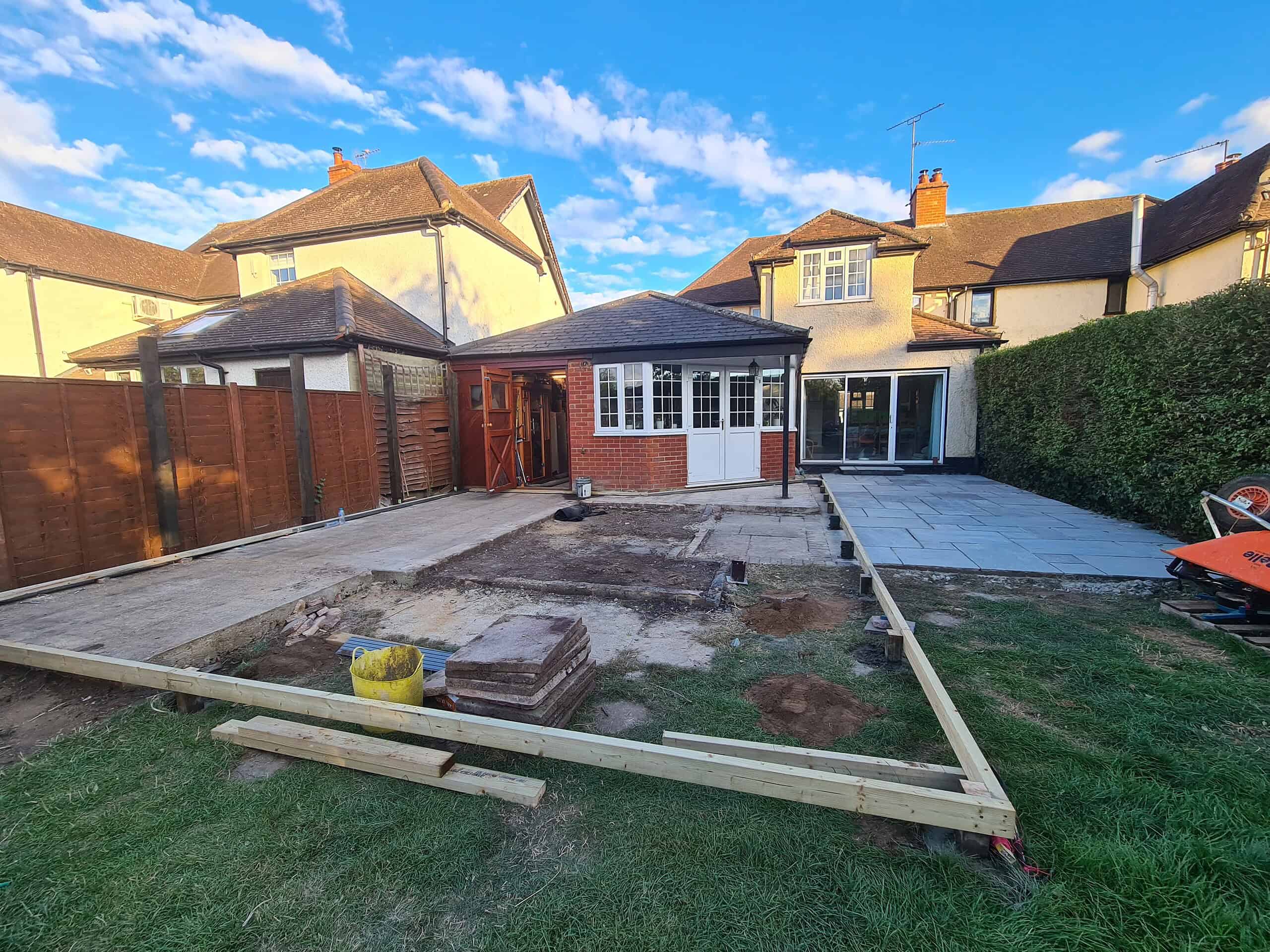 Installing composite decking in a London backyard for a modern outdoor space.