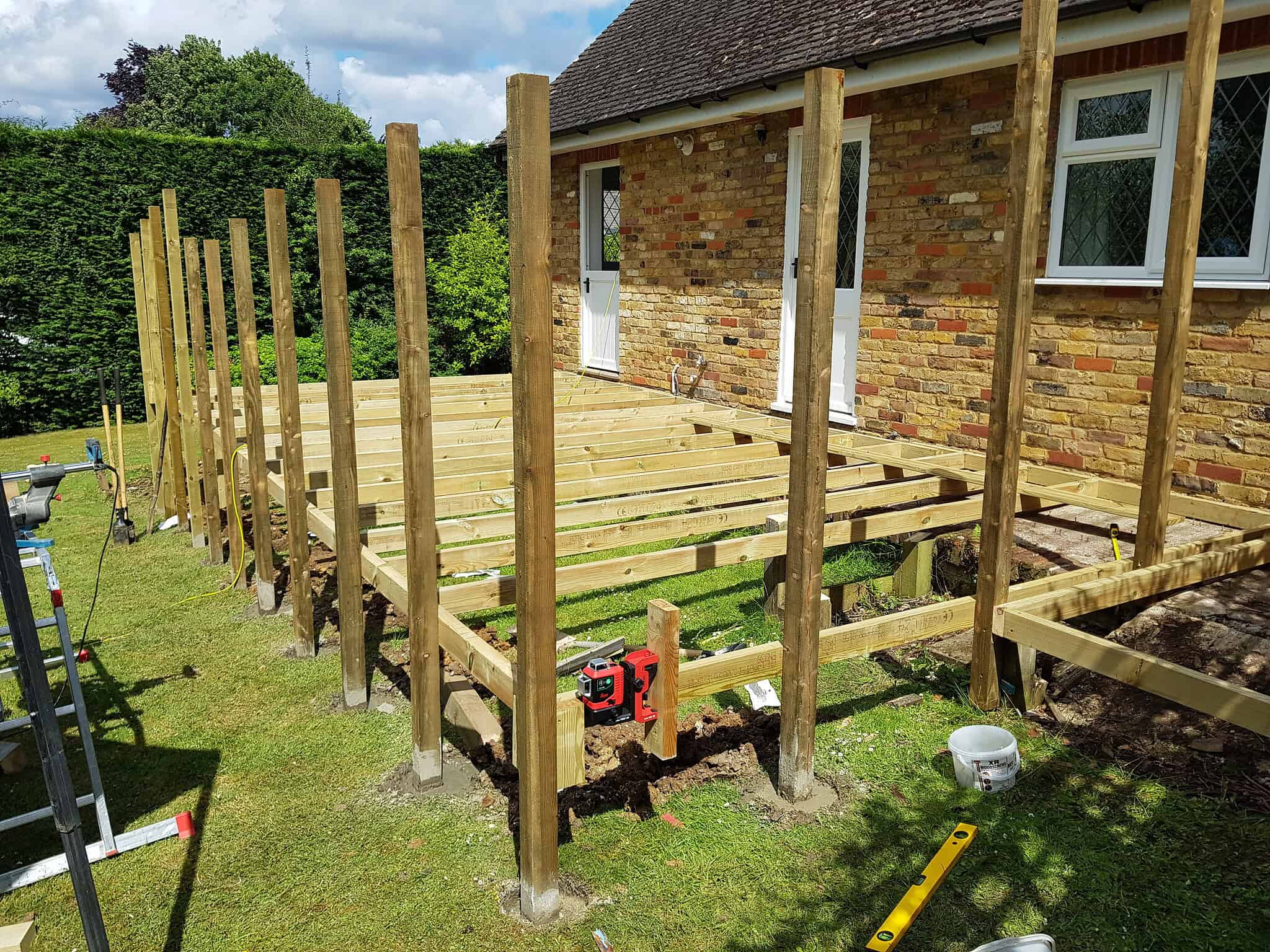 Big softwood decking being built in London for outdoor living space.